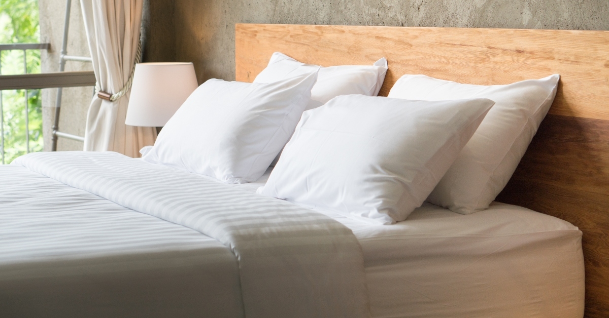 white pillows on the bed 