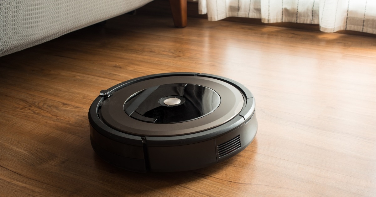 Robot vacuum cleaner on wooden floor
