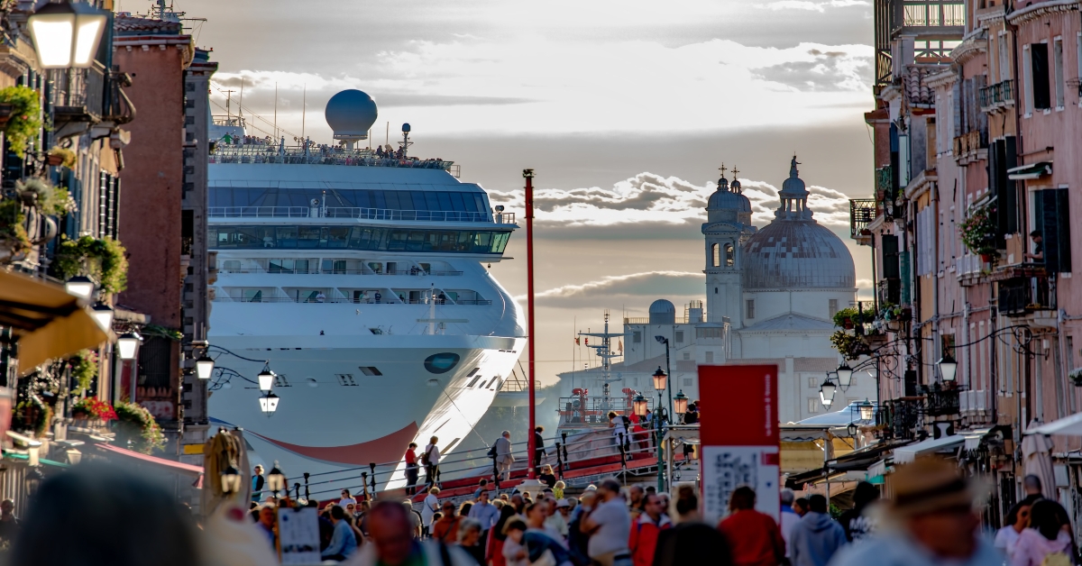 gigantic cruise ship leaving venice