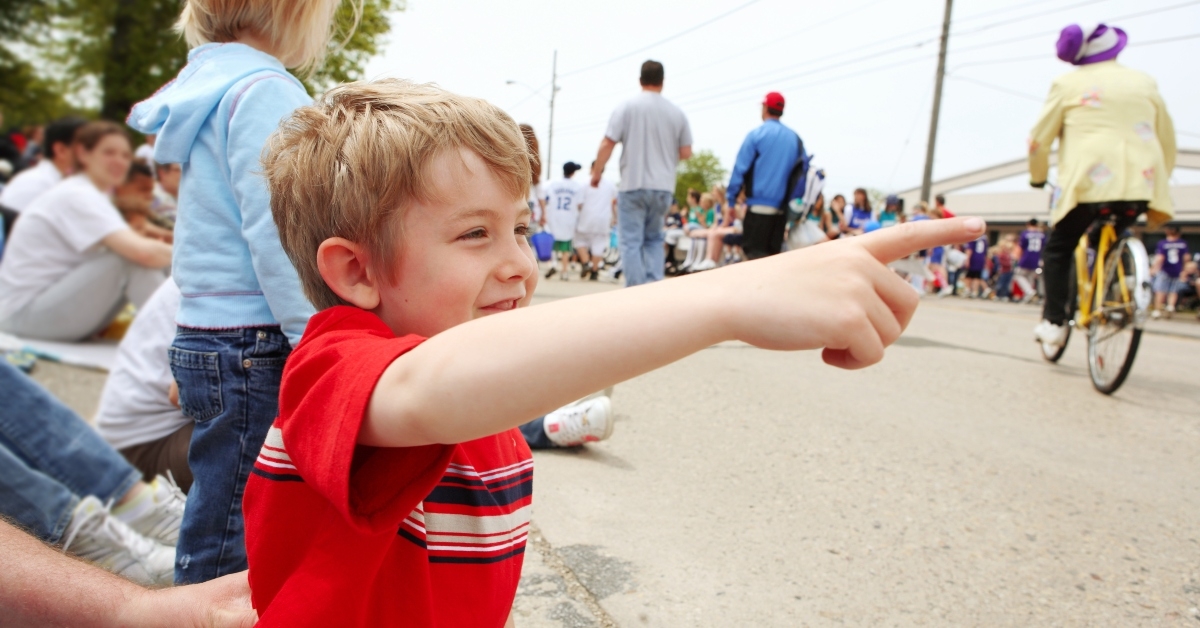 boy watching a parade,