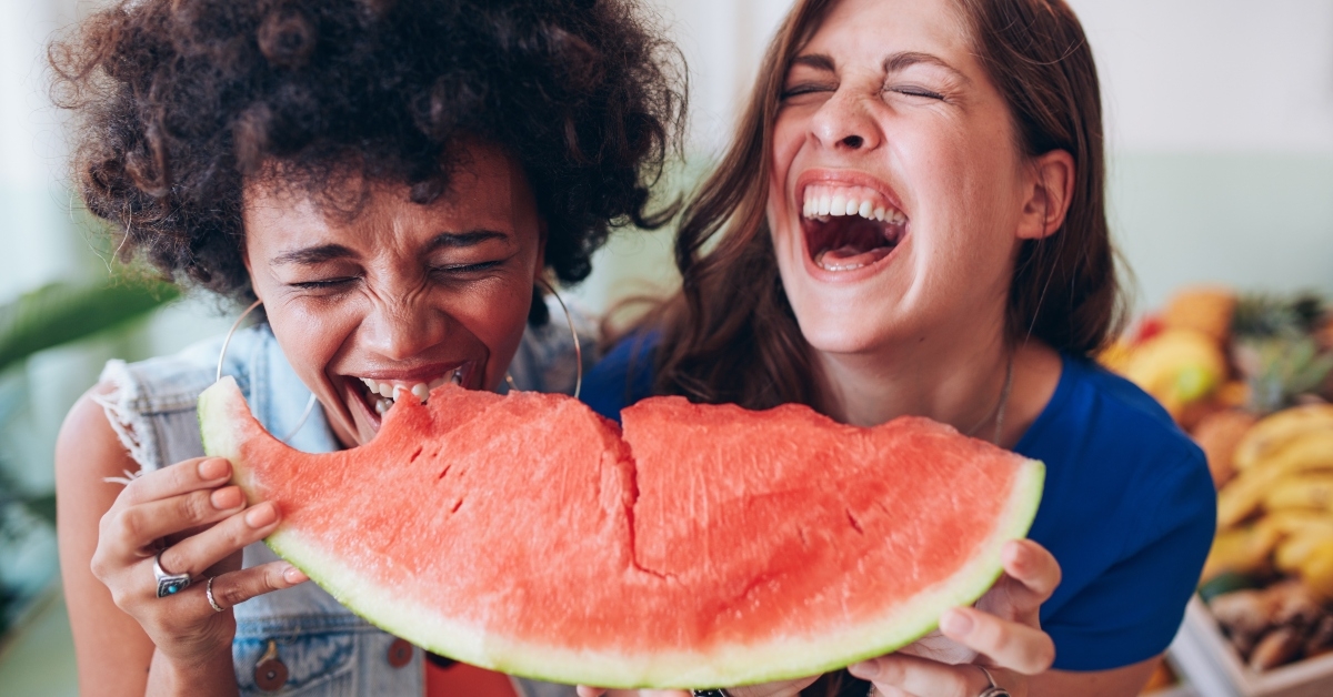 girls enjoying a watermelon