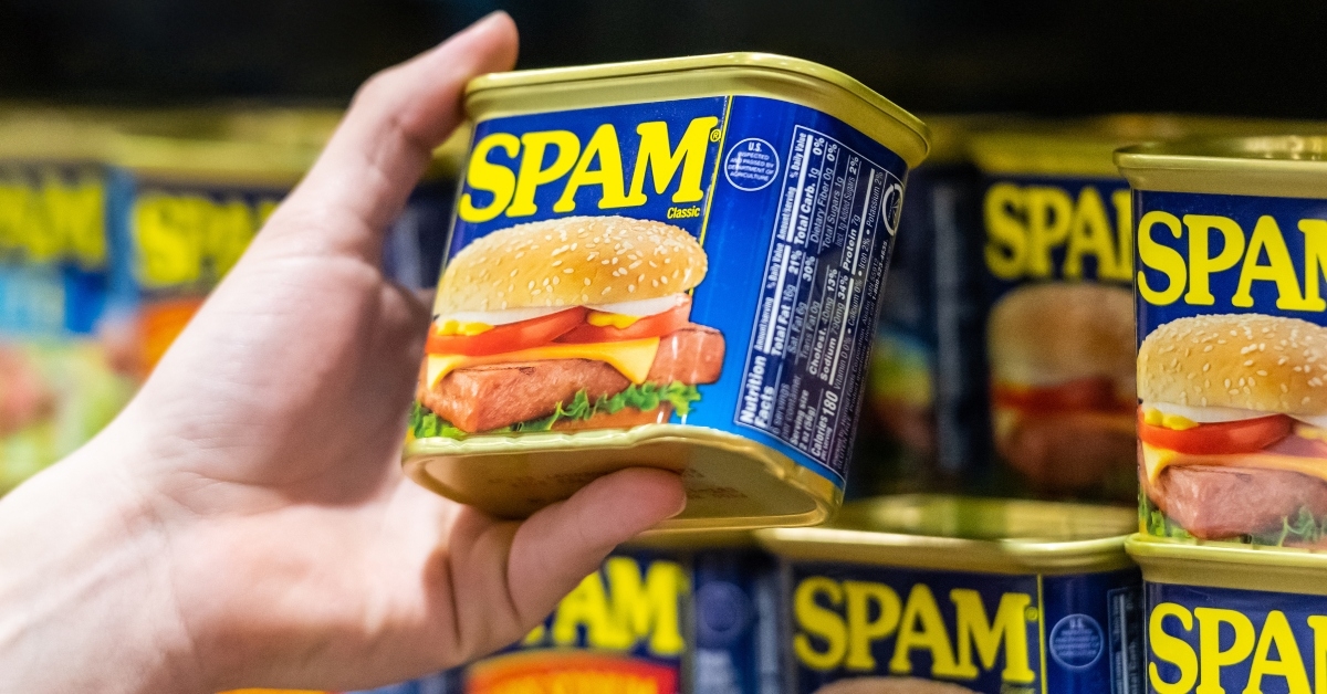 hand holding a can of SPAM