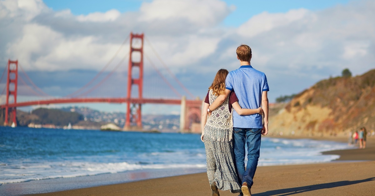 couple walking Baker beach San Francisco