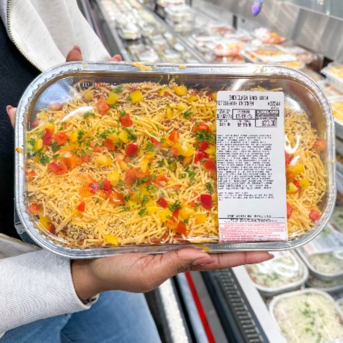 hand holding enchilada bake