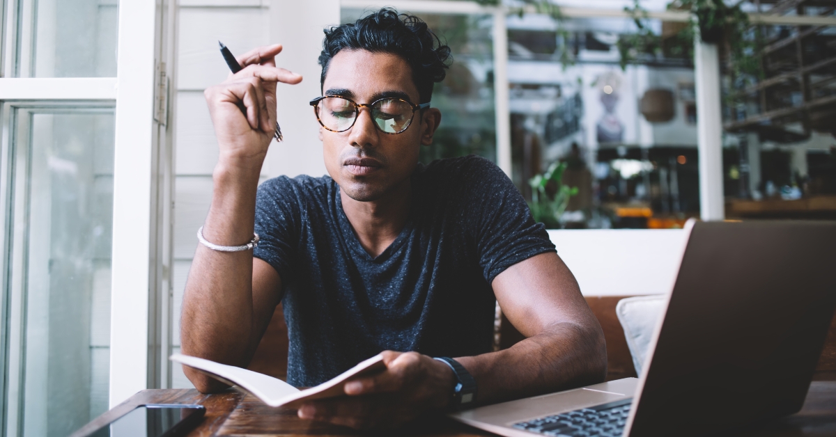 writing in journal while sitting