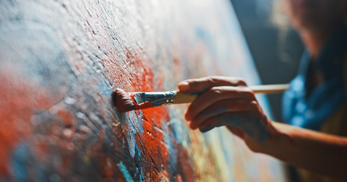 artist works on abstract oil painting