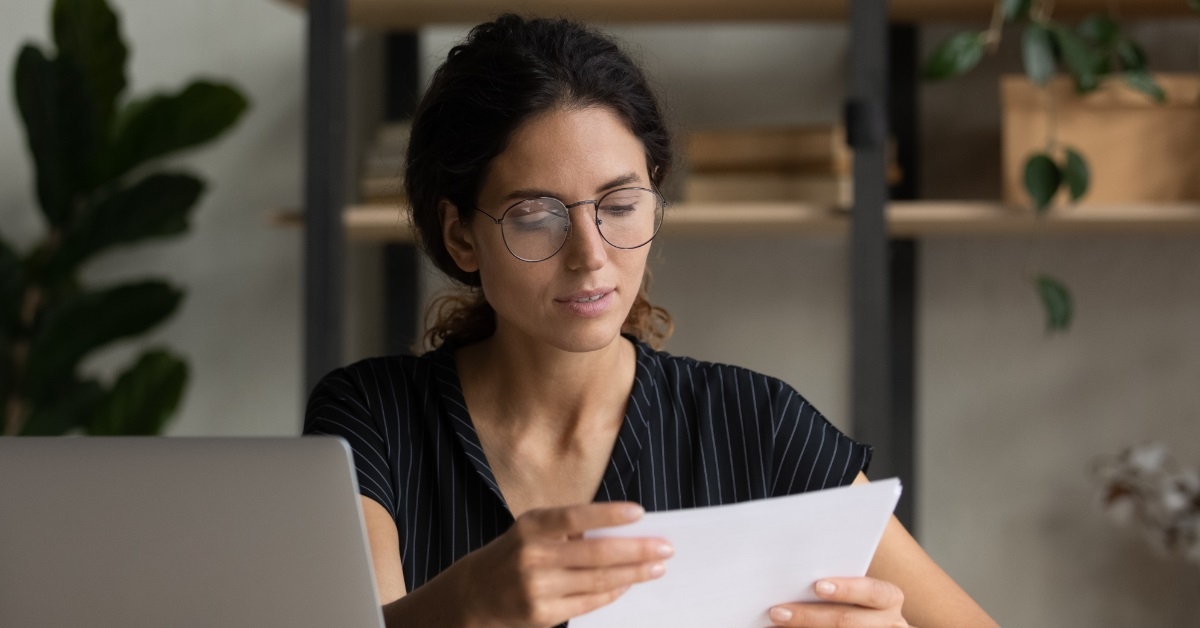 hispanic female doing paperwork