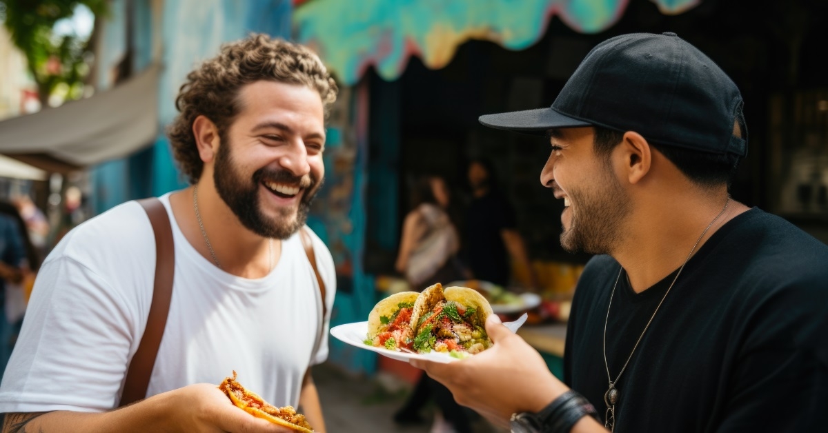 chef giving taco to man outdoor