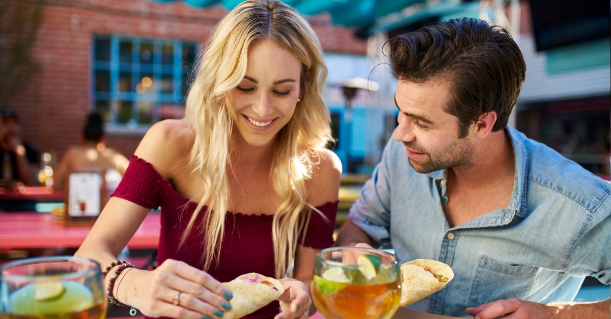 couple eating tacos at mexican restaurant
