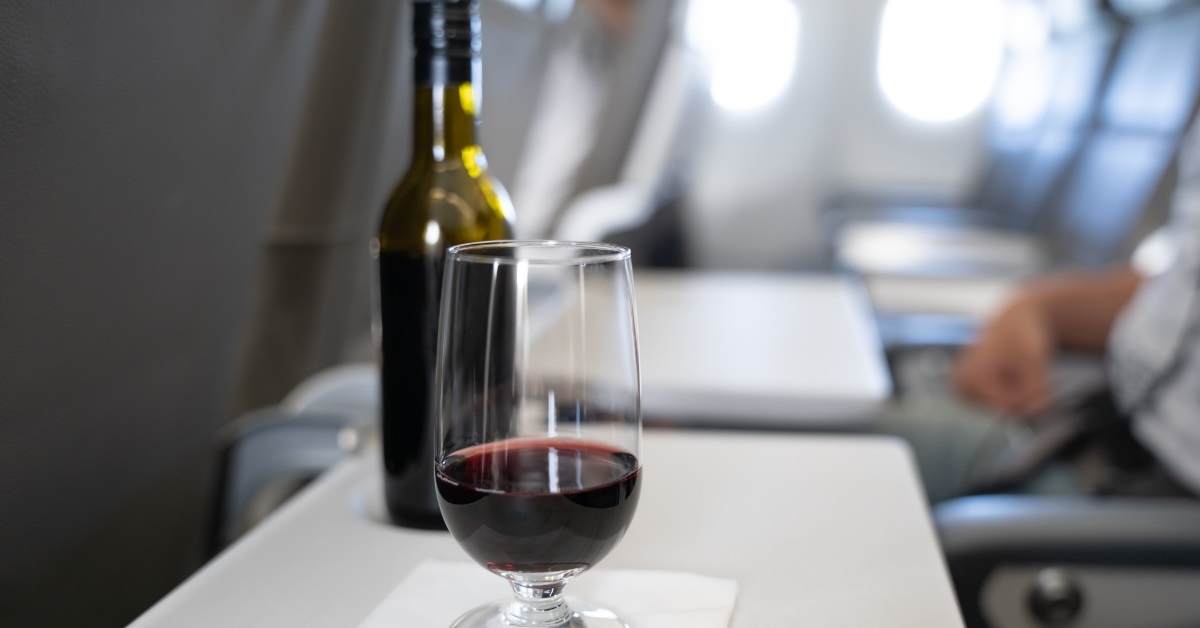 red wine glass on airplane tray