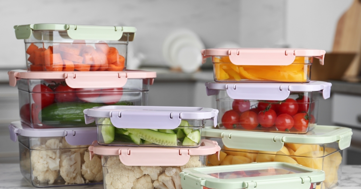 Boxes with vegetables on kitchen countertop