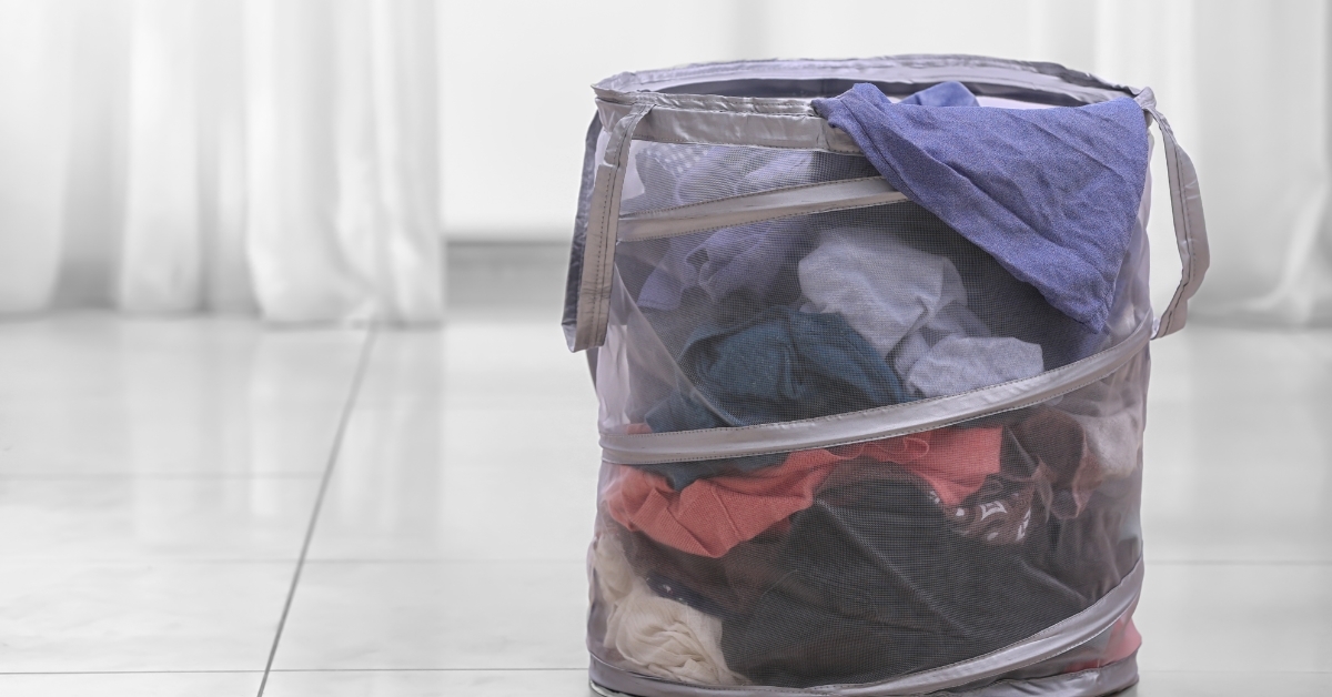 Laundry basket with clothes indoors