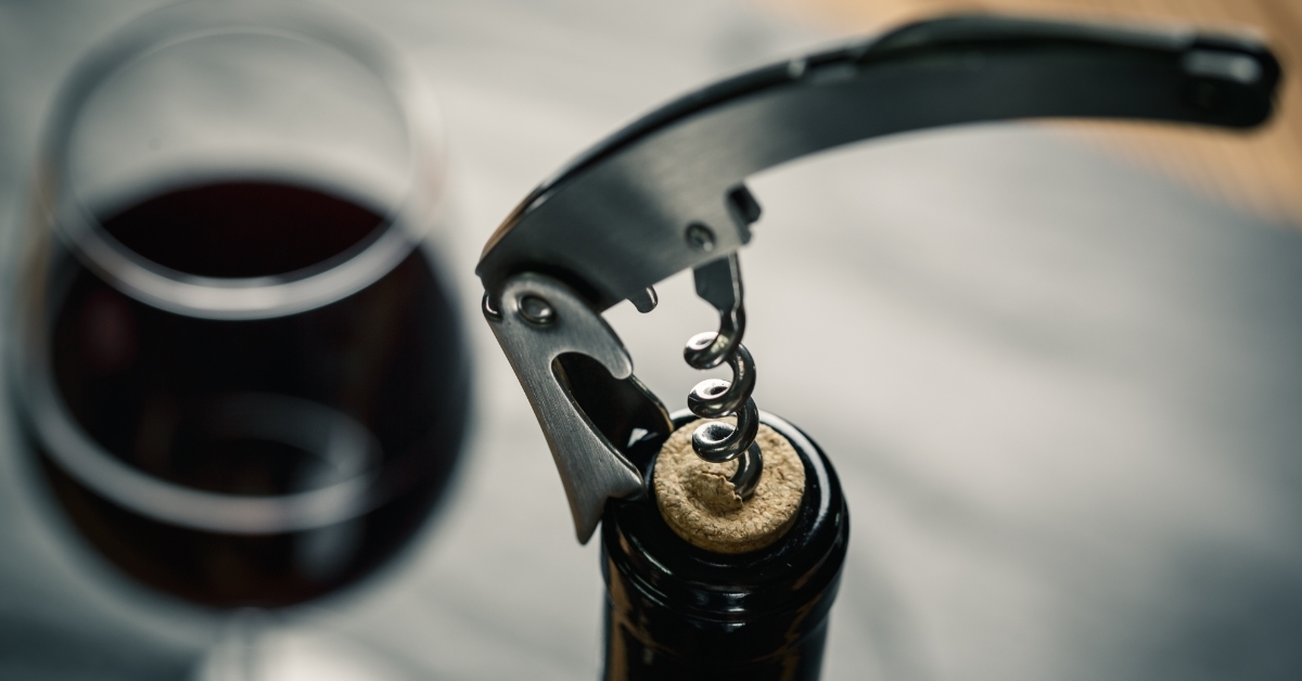 Stainless wine corkscrew in wine bottle