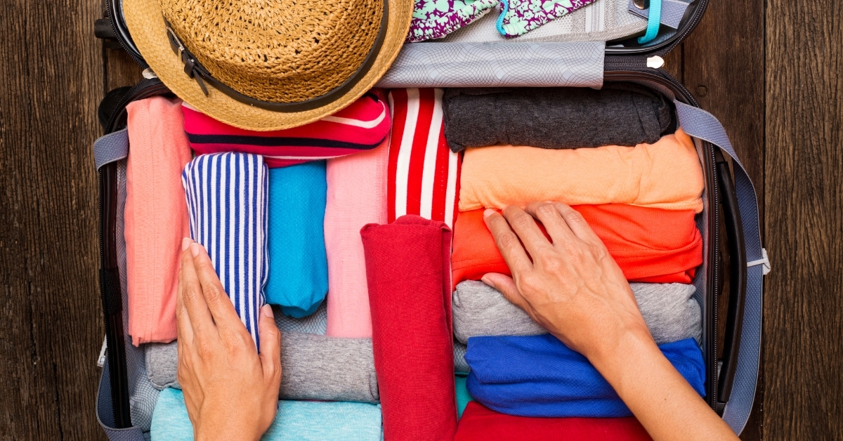woman packing luggage for holiday