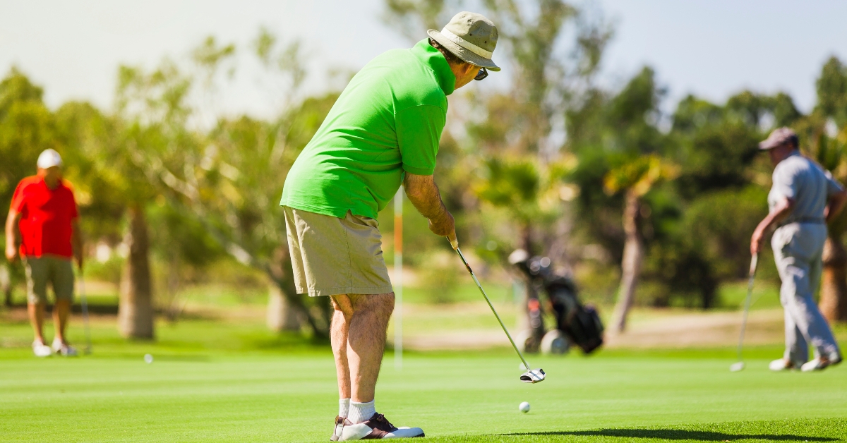 golf player wearing green shirt
