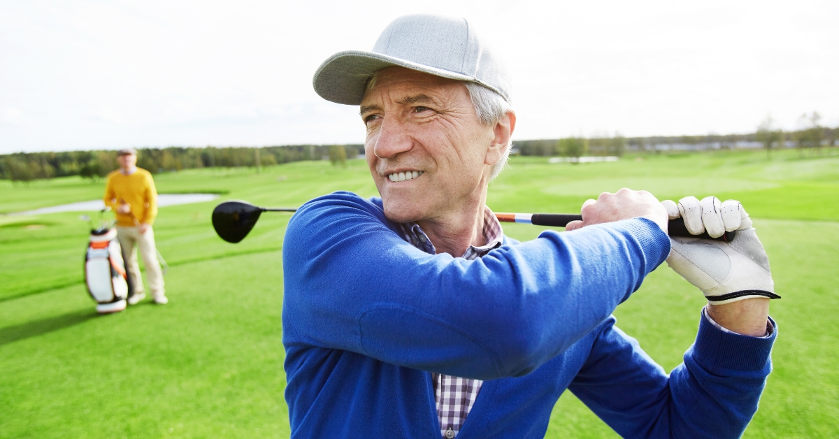 mature man hitting the ball