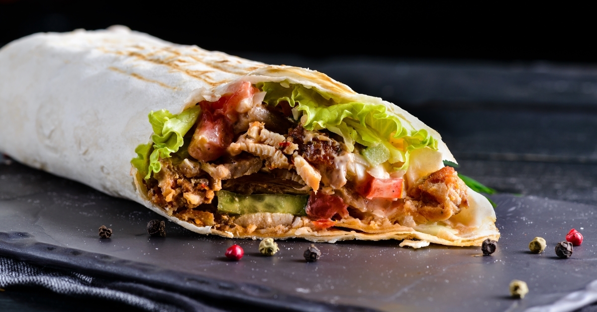Mexican beef steak burrito on tray