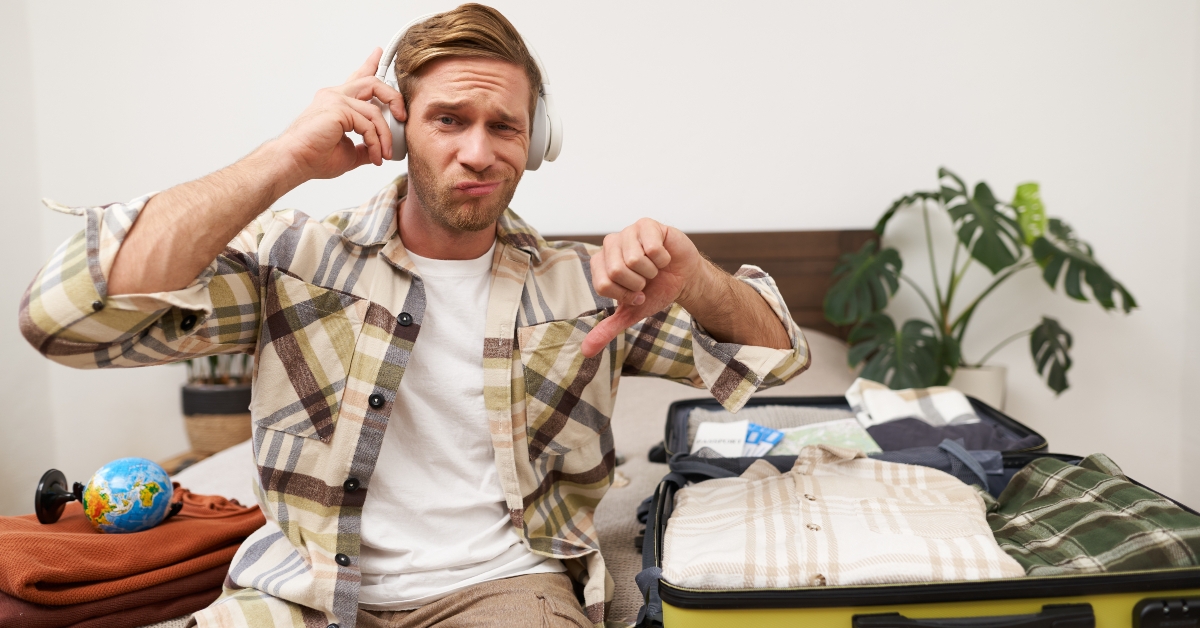 disappointed man in headphones