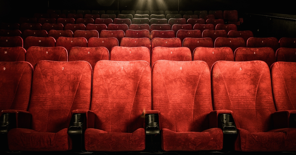 red seats with numbers in cinema