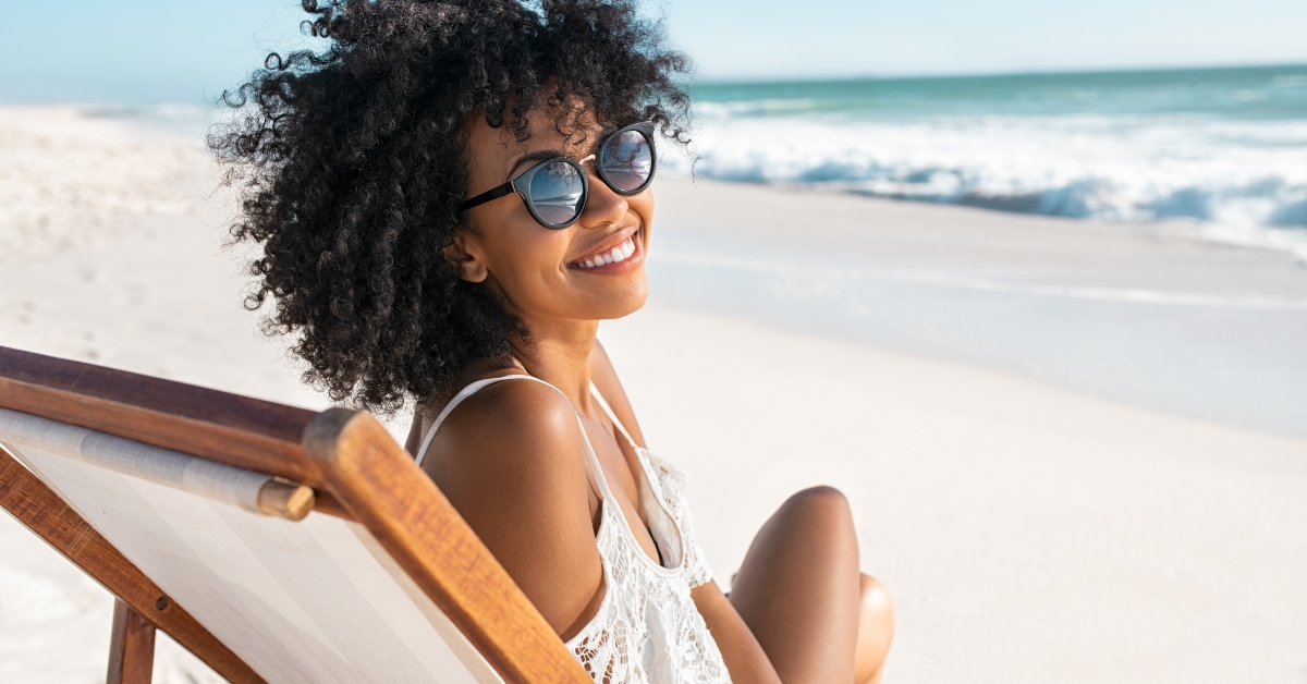 woman sitting on deck chair