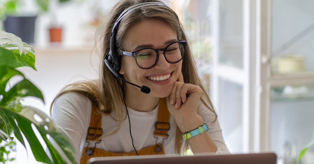 beautiful woman attending webinar on laptop