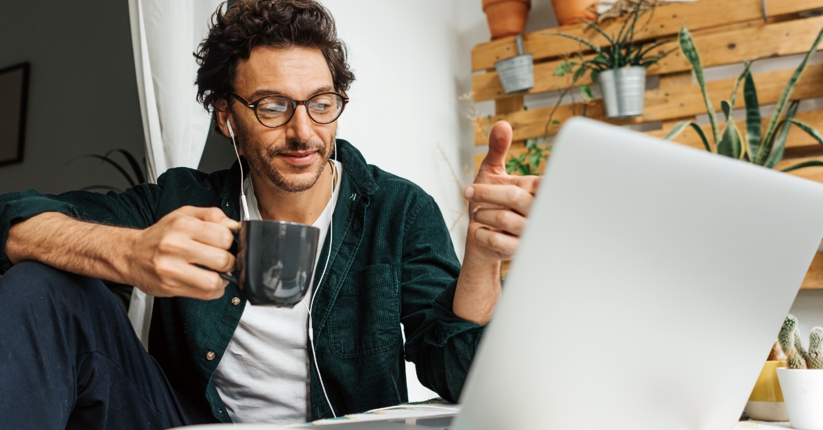 mature man working remotely on laptop