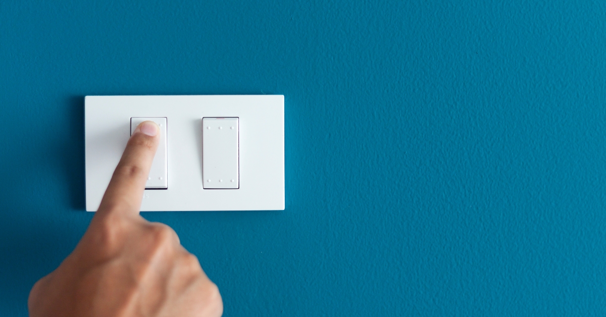 finger turning on lighting switch
