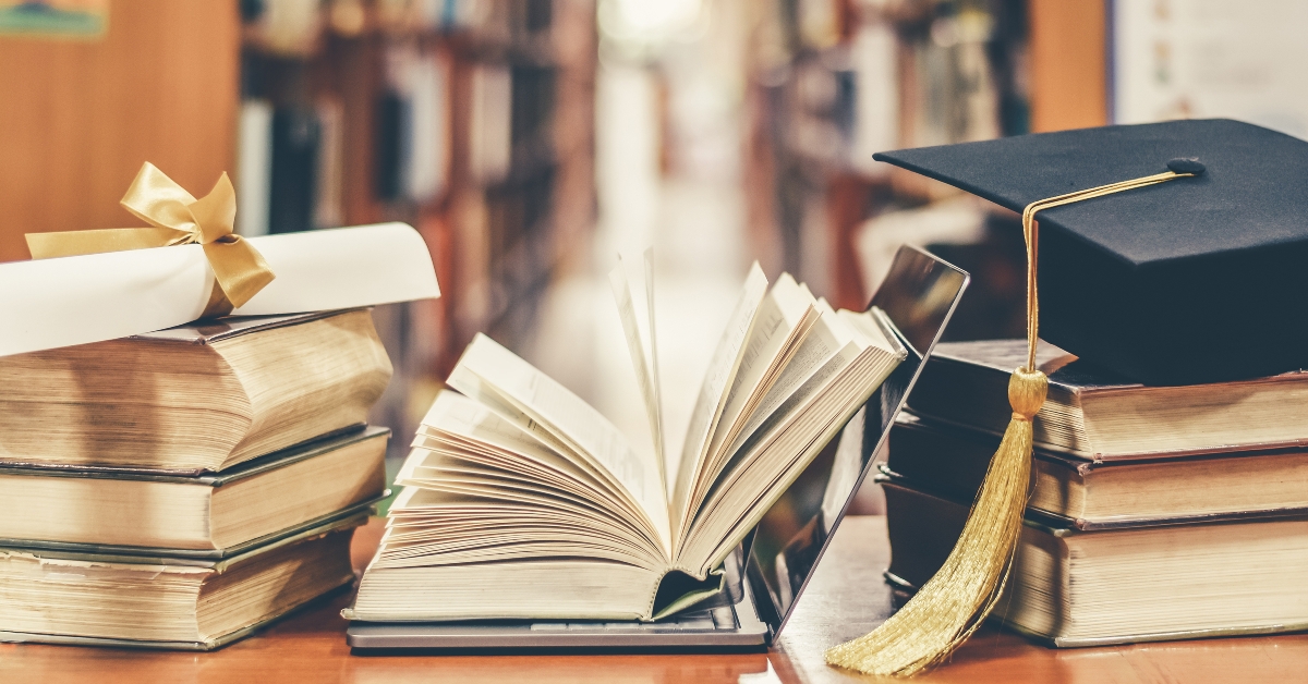 graduation hat and books
