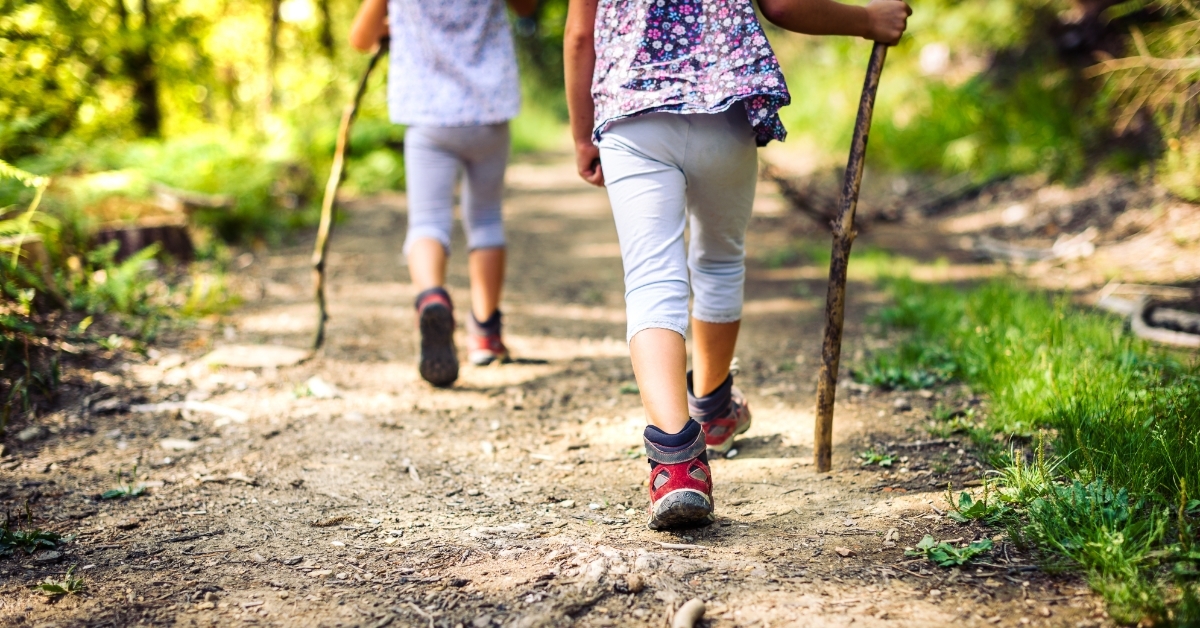 young Children hiking mountains together