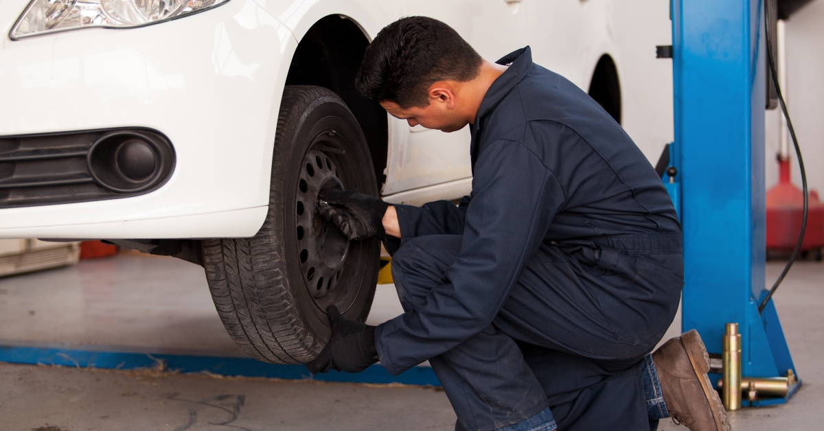 mechanic rotating tires