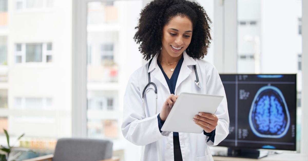 female neurosurgeon planning surgery using tablet