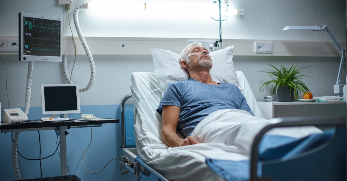 male patient resting in hospital bed
