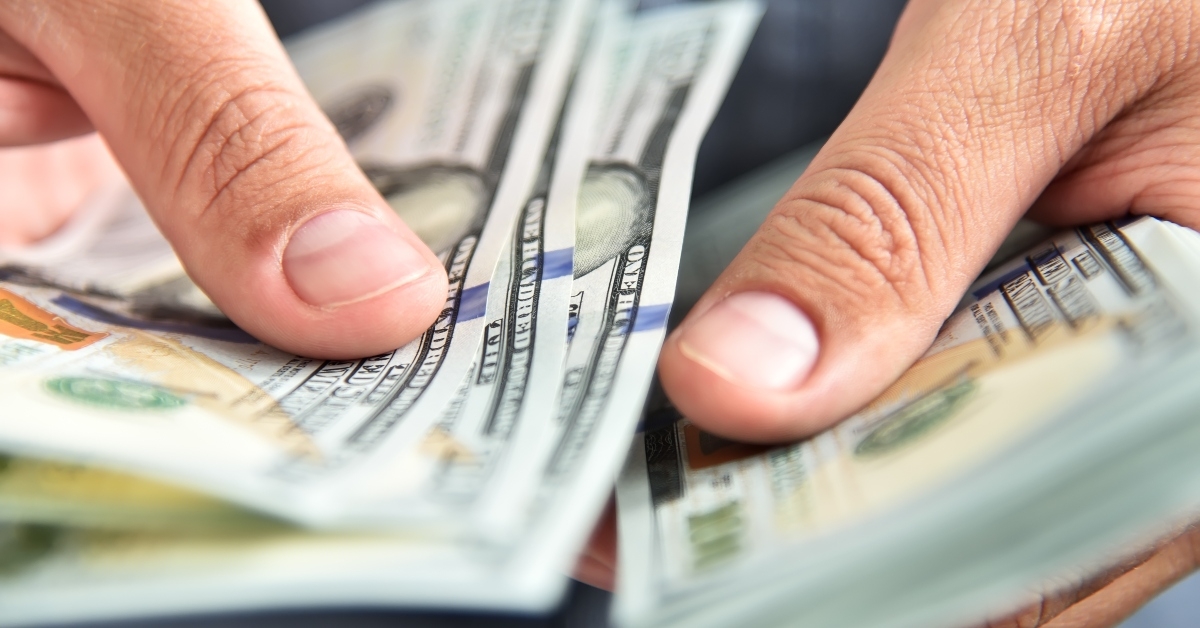 businessman counts money