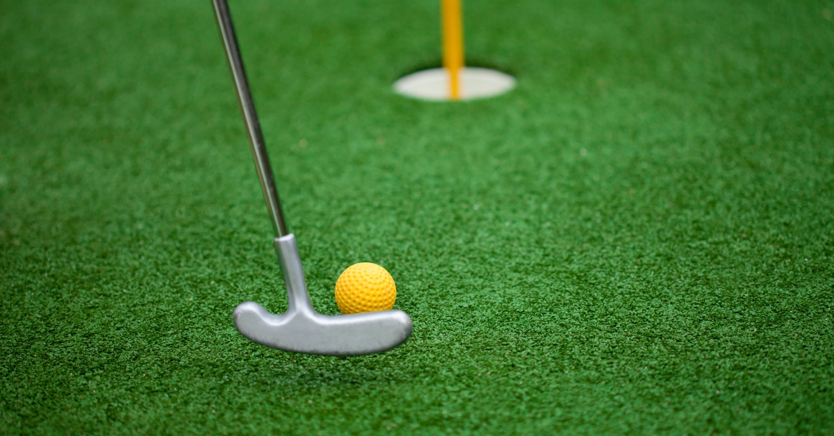 golf club ball and hole