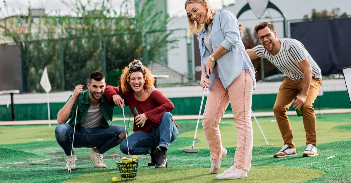 group of smiling friends enjoying
