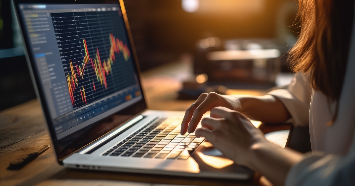 laptop with stock market chart