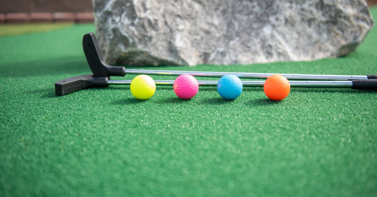 mini golf balls and clubs