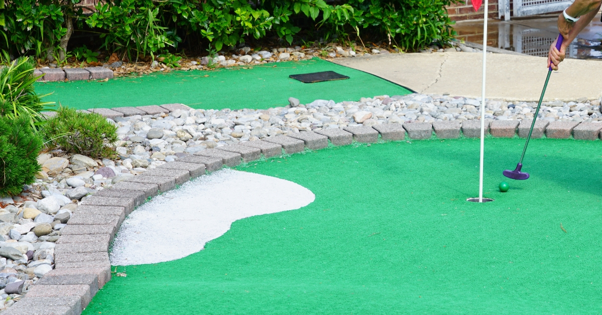 playing mini-golf outdoors
