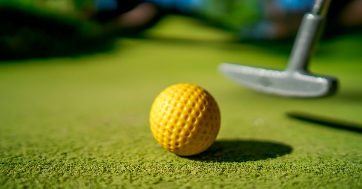 yellow ball with a bat