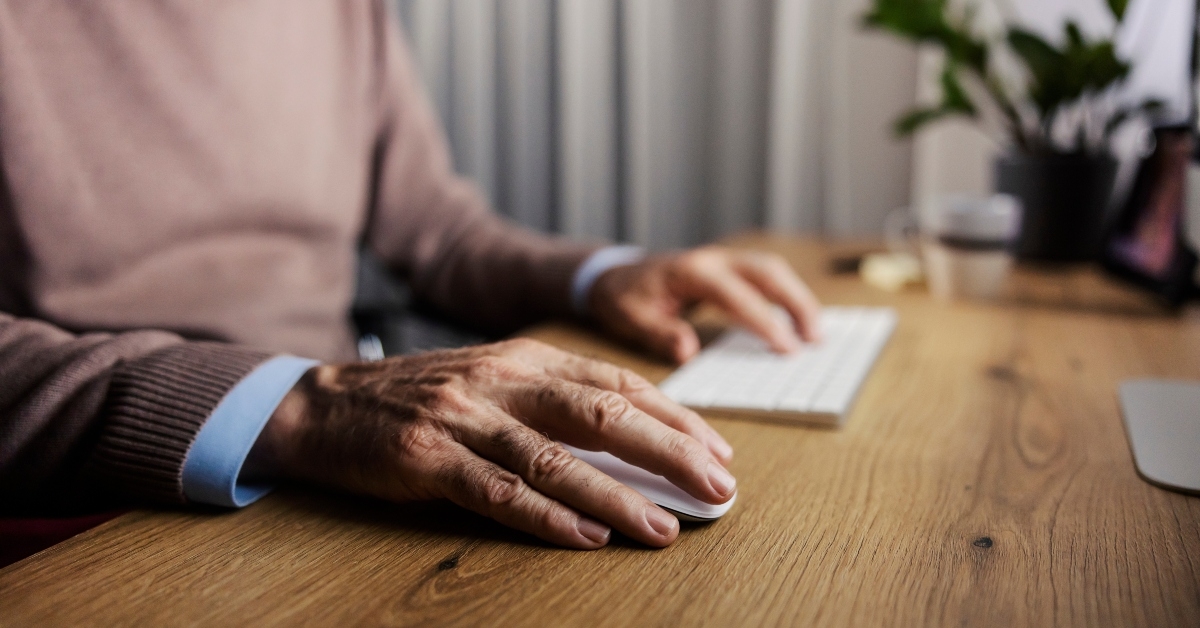 senior man using computer mouse