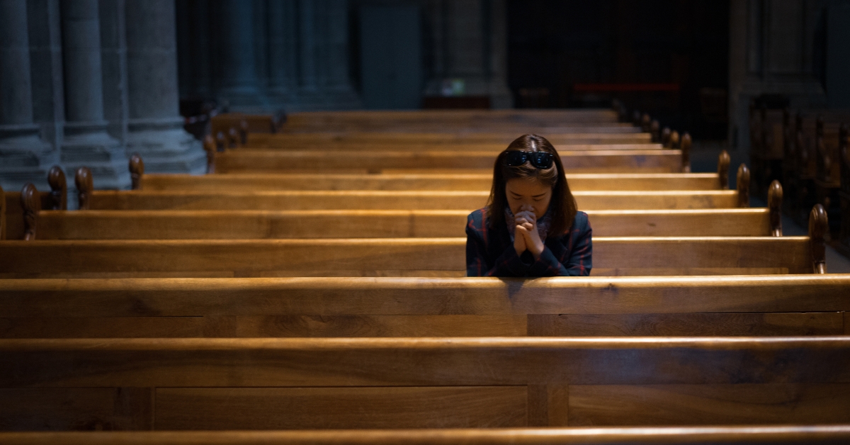 christian girl sitting and praying