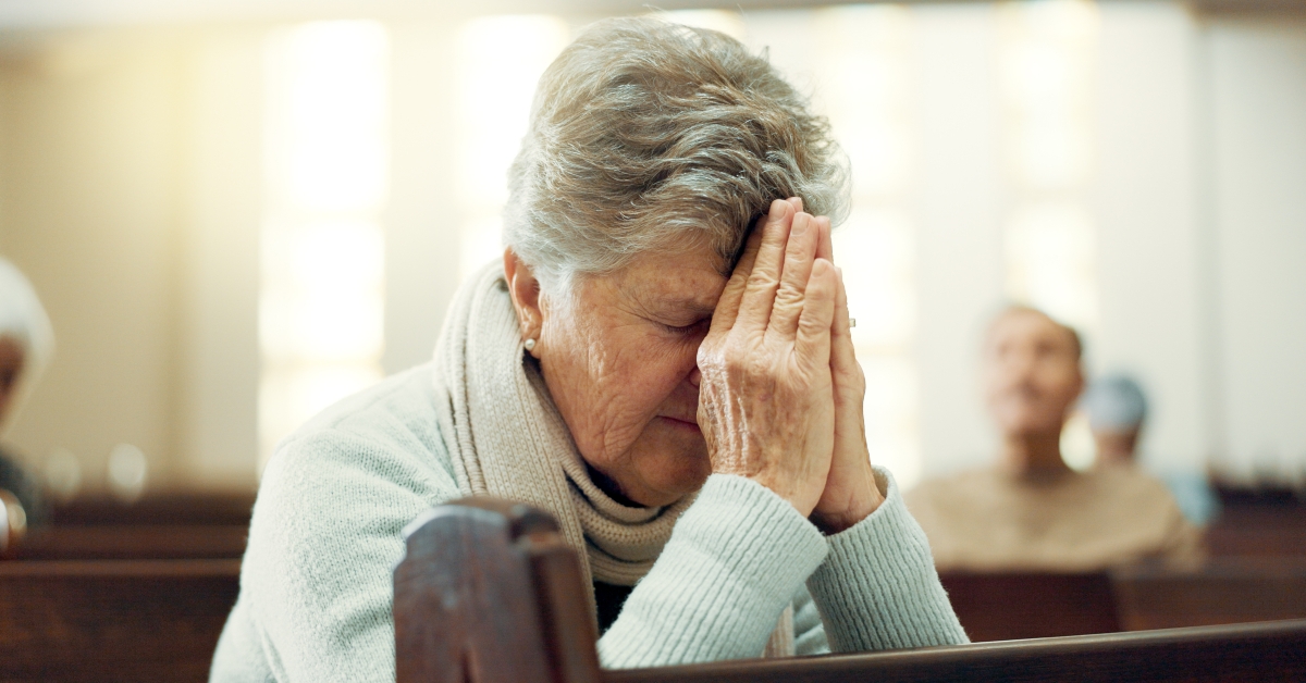 elderly person praying