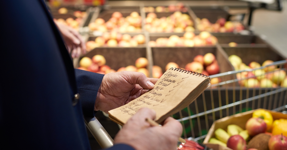 man holding shopping list
