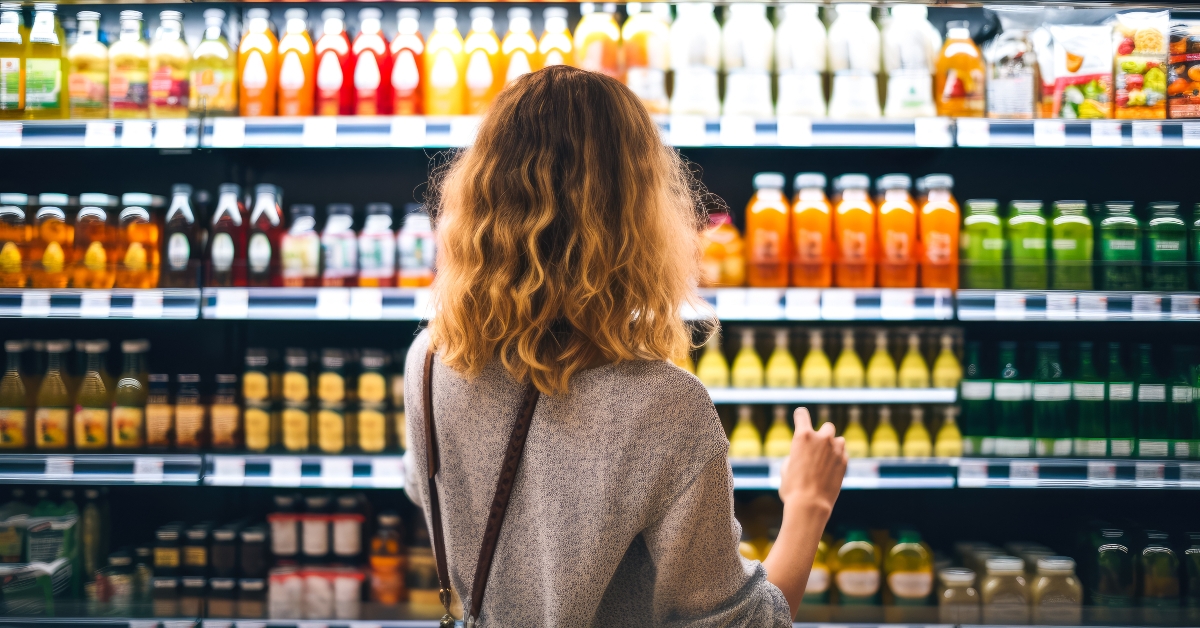 young woman looking at bottles