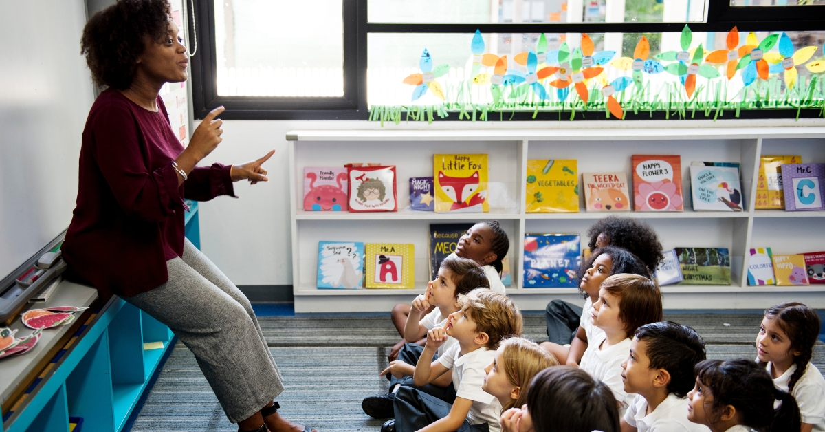 kid students listening to teacher