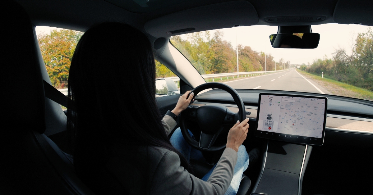woman traveling in electric car
