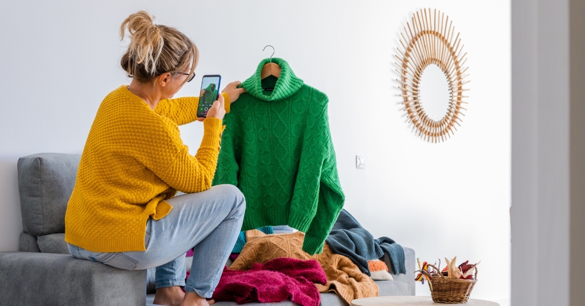 woman preparing clothes to sell online