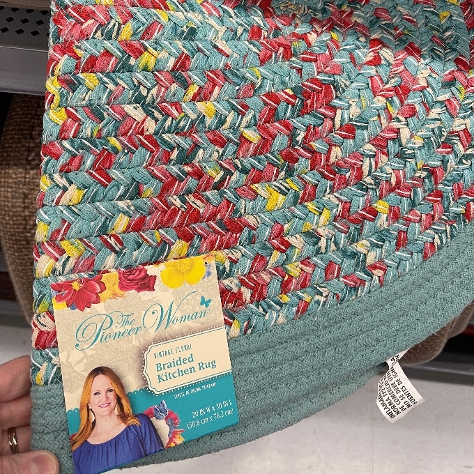 woman braided kitchen rug