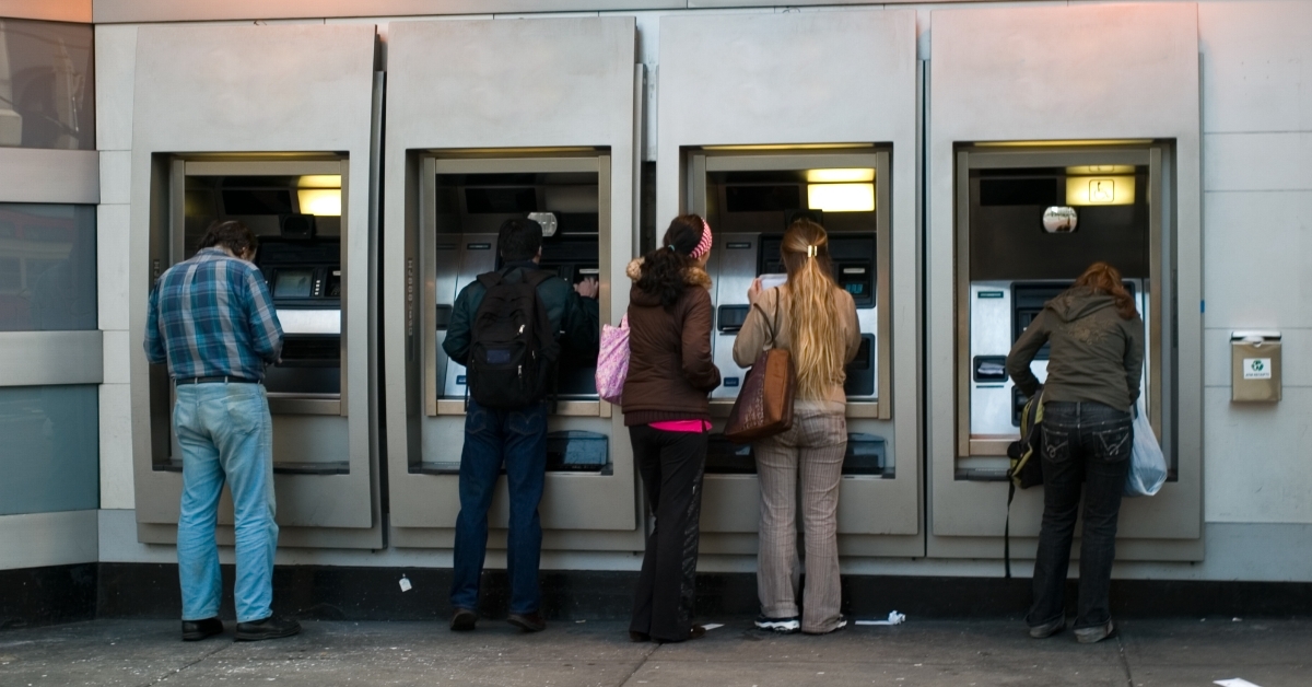 people using atm machines outdoor