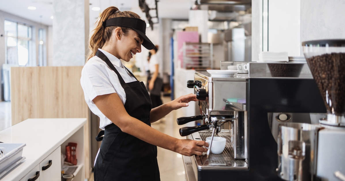 barista using coffee machine